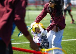 mother and daughter playing red ball
